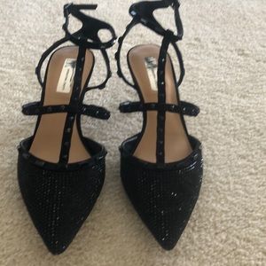 Black INC strap heels.